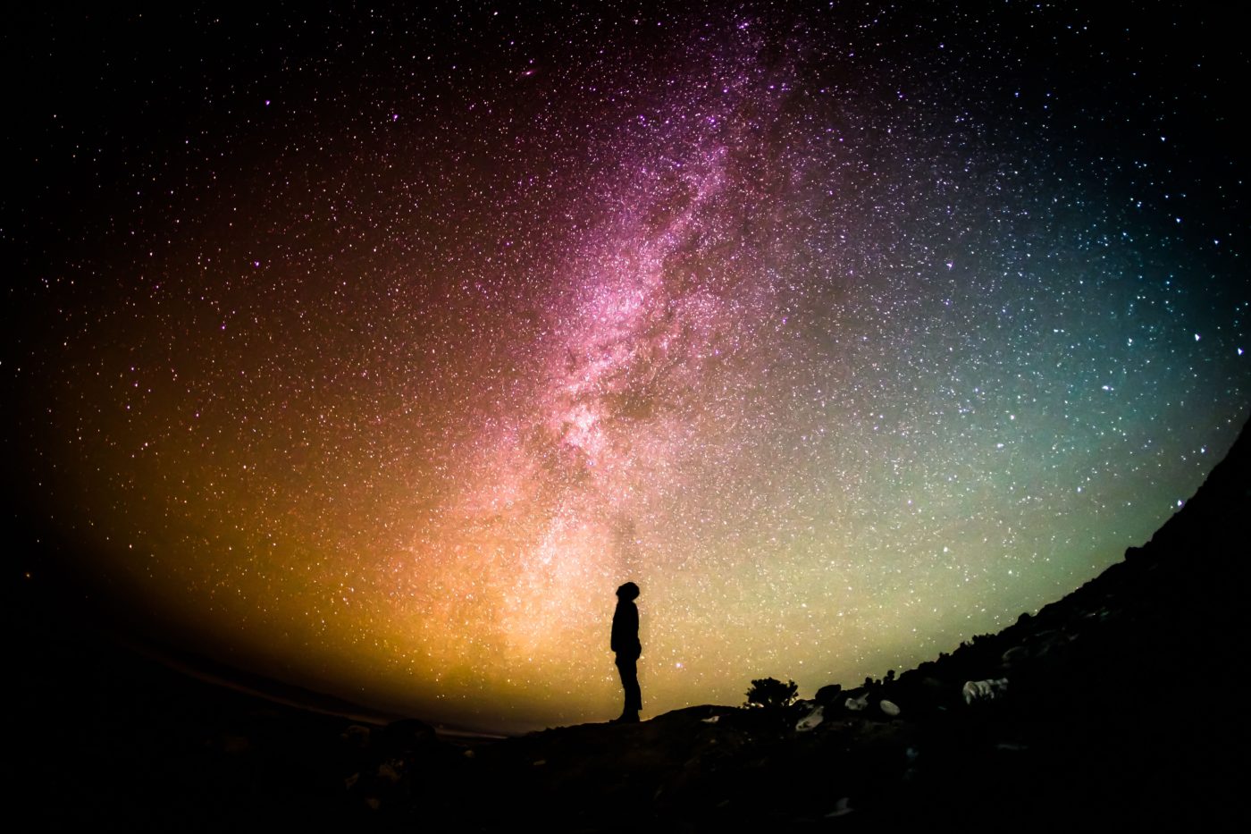 Silhouette of a man gazing at the galaxy