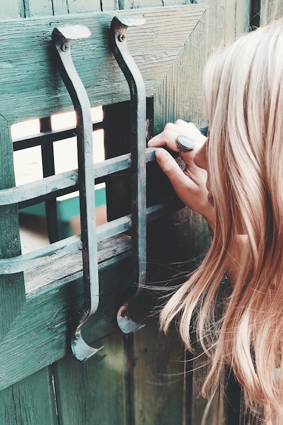 woman in front of gate