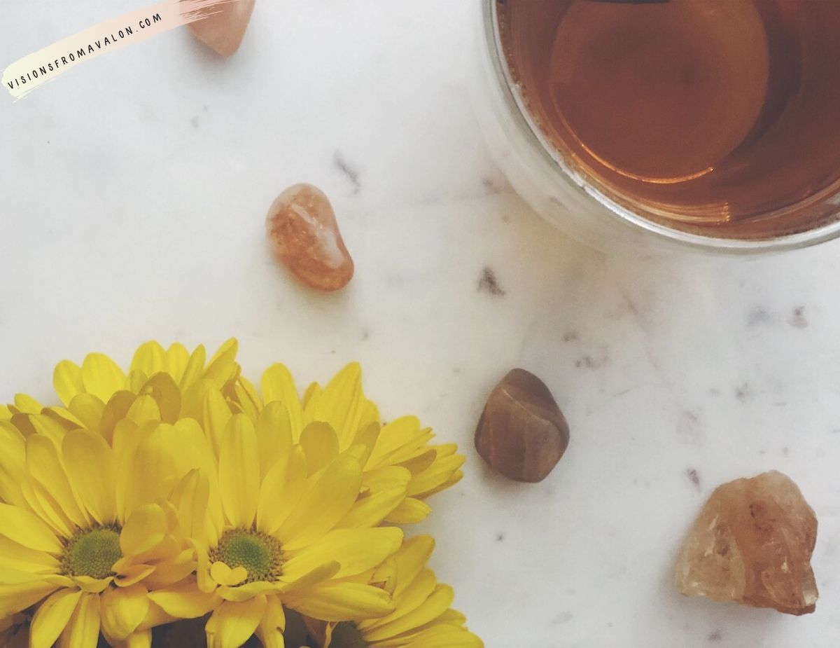 yellow flowers, orange chakra crystals, orange tea