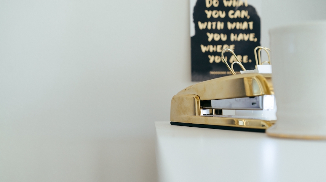 gold stapler and mug